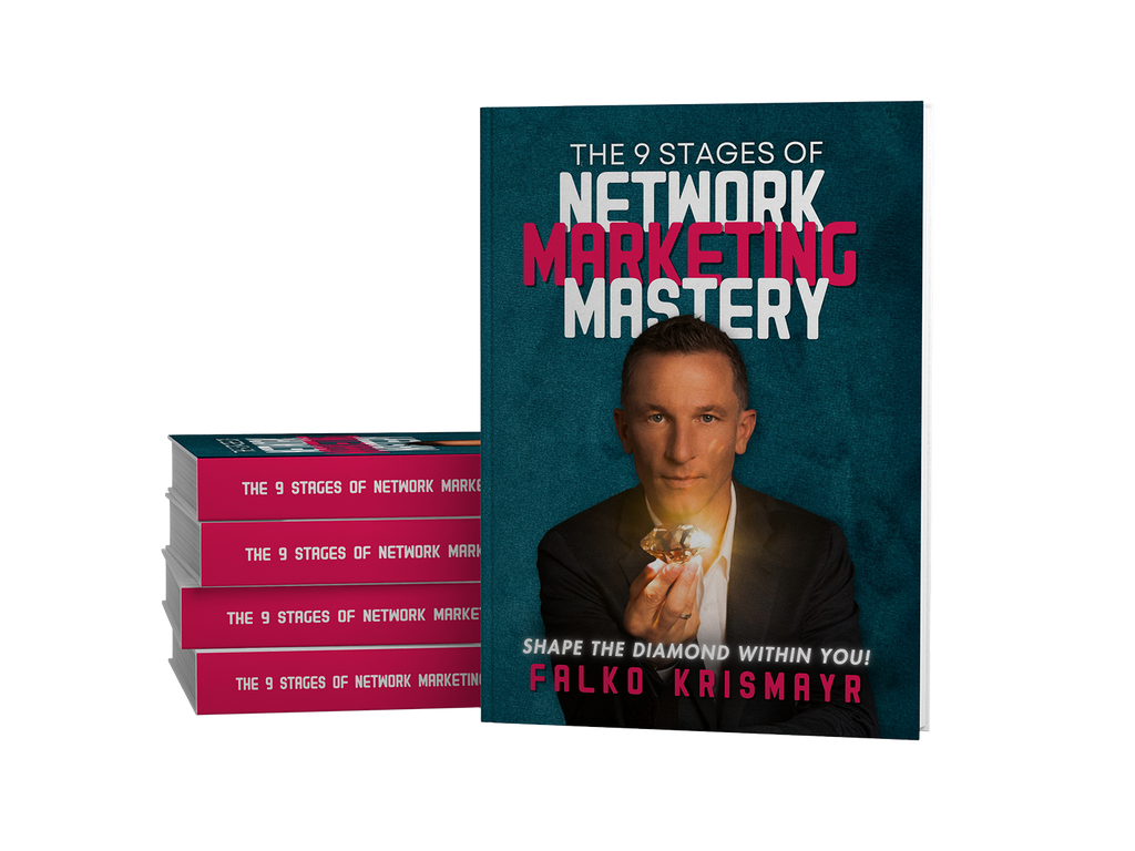A book titled "The 9 Stages of Network Marketing Mastery" by Falko Krismayr is displayed upright, with a stack of four copies lying beside it.